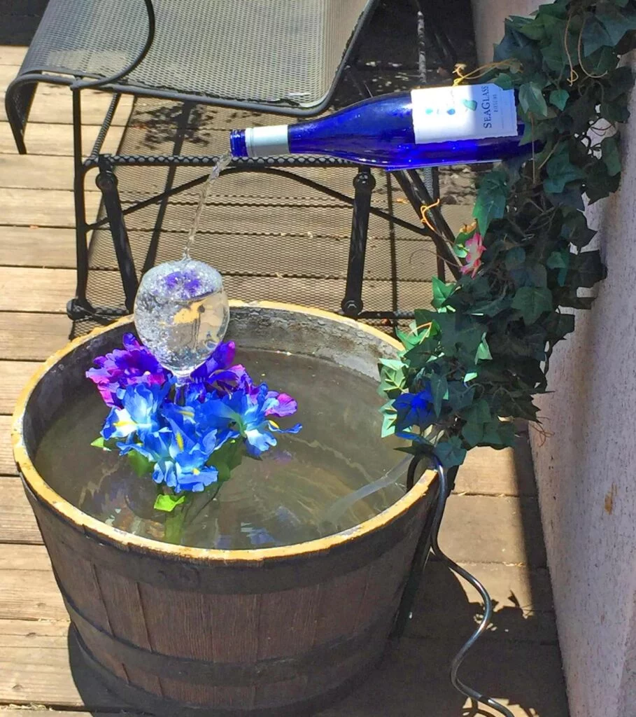 Gardening Bottle-Fountain-909x1024 20 DIY Bottle Garden Ideas for Green-Thumbed Gardeners